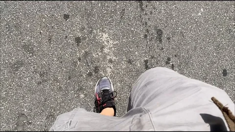 Top view of the legs of a man walking on the street 库存影片 129992859
