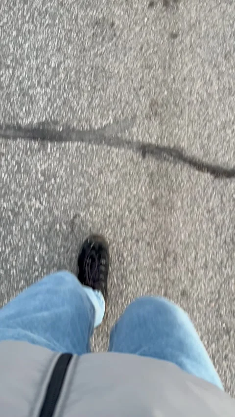 Top view on the legs of a person walking... | Stock Video | Pond5