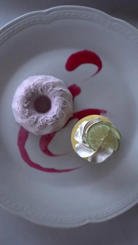 Top view of a Lemon Curd and Meringue Dessert with Raspberry Ice Cream Stock Footage 336272486