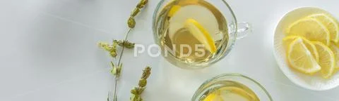 Top view of lemon tea glasses. Drinks flat lay. Seasonal refreshment break Stock Photos