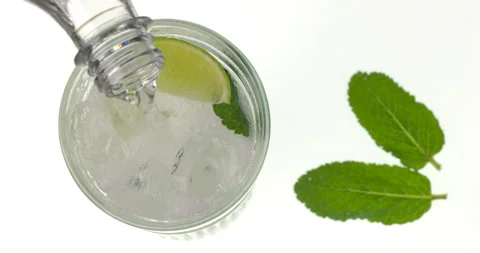 Top view of lemonade making process on white background. In glass with crushed Stock Footage 148324196