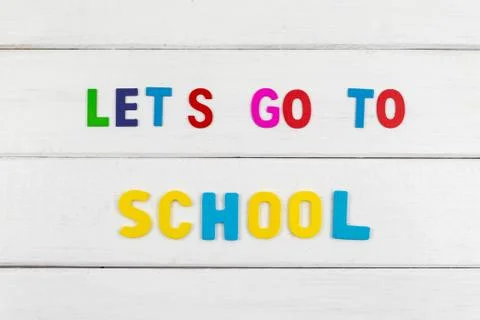 Top view of Let's go to school wording on wooden background Stock Photos