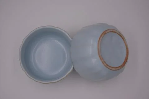 Top view of light blue ceramic cups with white background Stock Photos