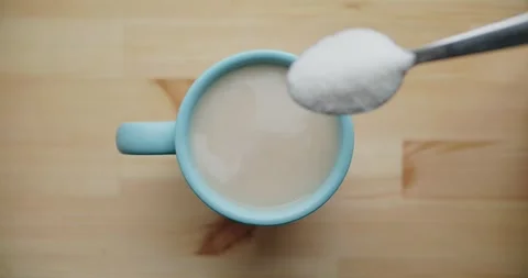 Top View of Light Blue Coffee Mug with Creamy Drink Stock Footage 300599771