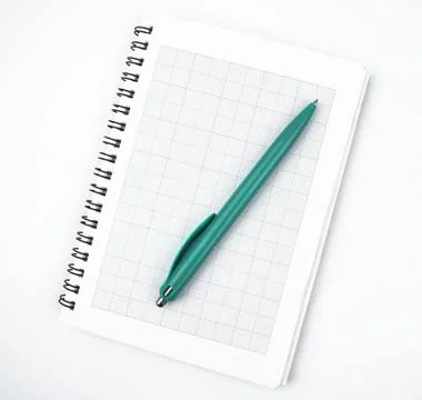 Top view of a light blue colored pen placed on top of a simple open white pap Stock Photos