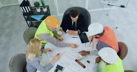 Top view of likable confident professional diverse team of engineers in vests Stock Footage 145605060