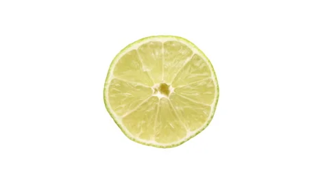 Top view of lime fruit cross cut rotating on white background. Stock Footage 158548882