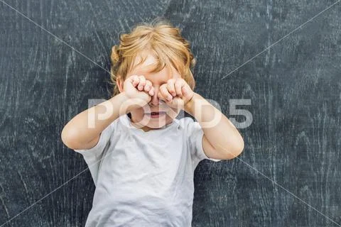Top view of a little blond kid boy with space for text and symbols on the o.. Stock Photos