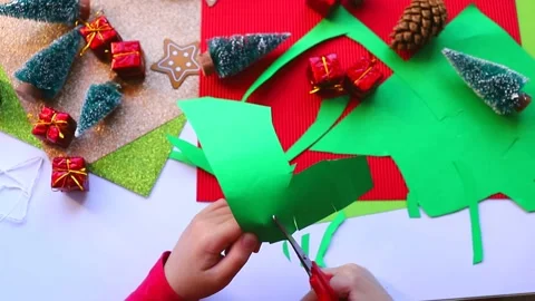 Top view. Little kid doing New Year or christmas card. Table with Christmas d Stock Footage 143089855