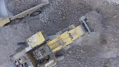 Top view loading into a huge mining dump... | Stock Video | Pond5