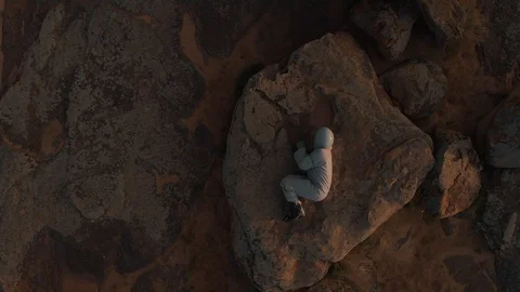 Top view of a lone astronaut on Mars. The astronaut lies on the surface of the 스톡 동영상 126776886