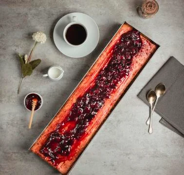 Top view of long pie with cherry jam Stock Photos