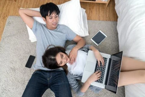 Top view of Lover using the digital tablet at modern home sleeping on the Car Stock Photos