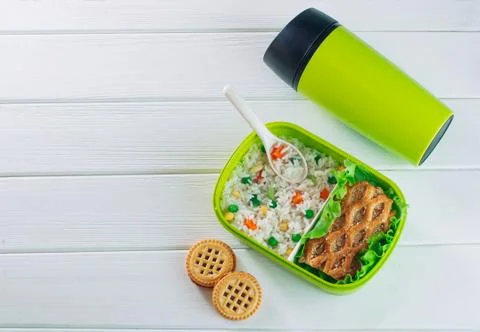 Top view of lunch box on light wooden background Stock Photos