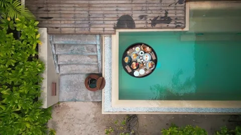 Top view of luxury floating breakfast in private pool. Special menu with Stock Footage 244895692