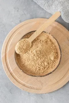 Top view of maca root powder on neutral grey background 库存照片