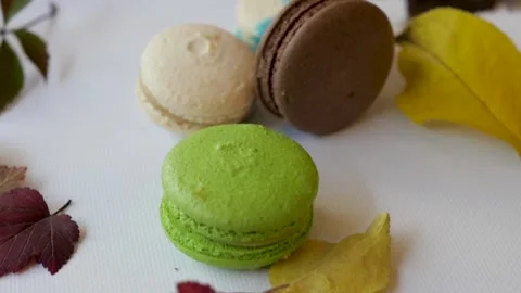 Top view of macarons on a white background surrounded by autumn leaves. autumn Stock-Footage 139295641