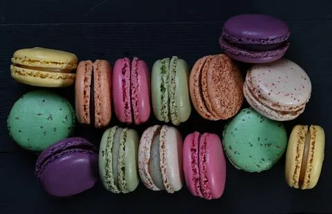 Top view macaroons on black background Stock Photos