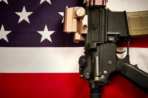 Top view of a machine gun on the background of the USA flag Stock Photos