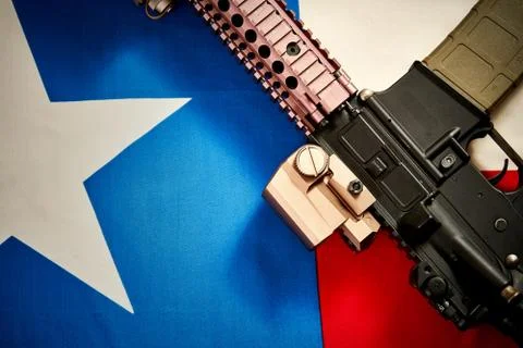 Top view of a machine gun located on the background of the texas flag Stock Photos