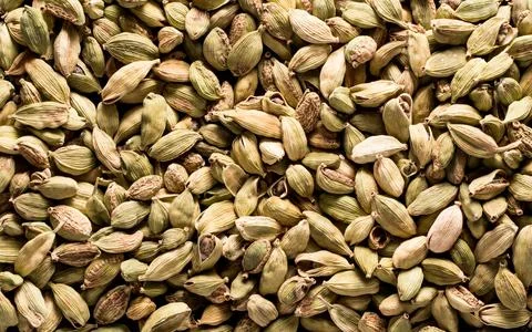Top view macro closeup on plenty of green cardamom spice. Stock Photos