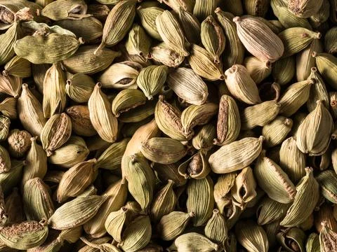 Top view macro closeup on plenty of green cardamom spice. Stock Photos