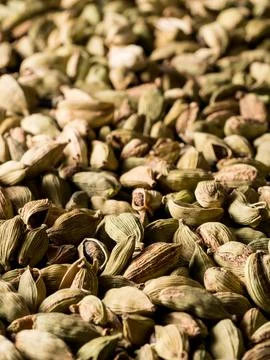 Top view macro closeup on plenty of green cardamom spice. Stock Photos