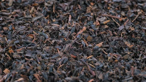 Top view, macro. Heap of ground dried black tea leaves, slider shot. Stock Footage 292529505