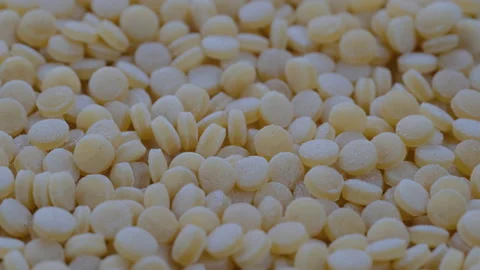 Top view, macro. Heap of raw dry couscous (kuskus) groats, cereals. Slider shot Stock Footage 292515774