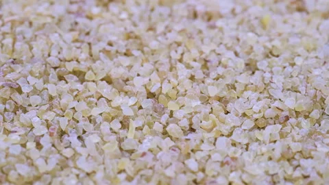 Top view, macro. Heap of raw uncooked bulgur grains. Slider shot. Stock Footage 292522844