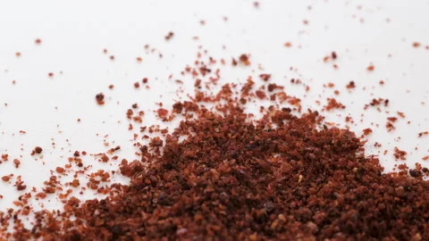 Top view, macro. Heap of scattered dry red sumac powder, Slider shot. Video stock 292527365