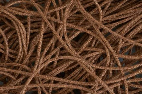 Top view macro of tangled brown jute rope as an abstract background. Stock Photos
