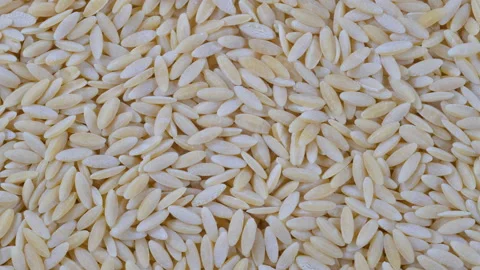 A top-view macro video of Orzo (Risoni) Pasta Stock Footage 285903493