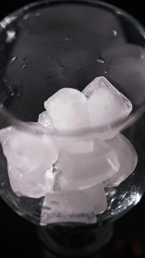 Top View Macro of Wet Crystal Glass with Light Reflections and Bubbles Stock Footage 339366167