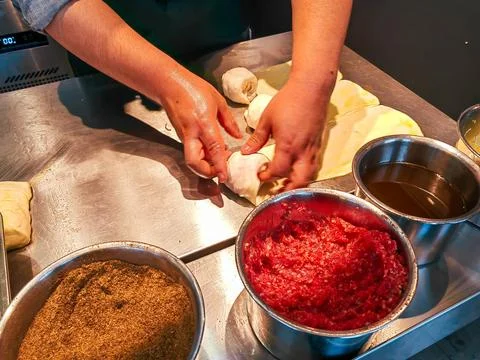 Top view of making a crispy stuffed meat flatbread in the kitchen Stock Photos