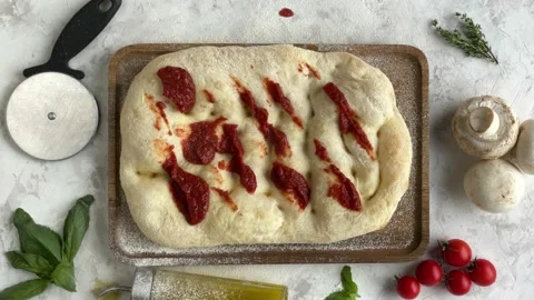 Top view of making a pizza with ingredients. Stop motion animation Stock Footage 160896985