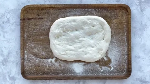 Top view of making a pizza with ingredients. Stop motion animation Stock Footage 162394894