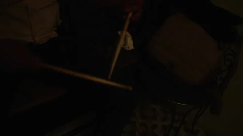 Top-view, male drummer practicing with drum sticks on his knees in backstage Stock Footage 133490733