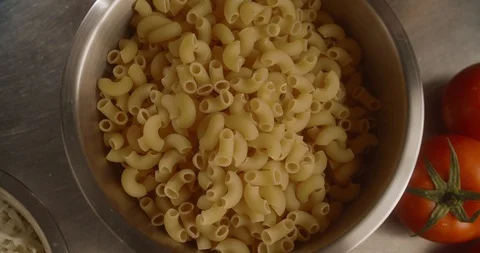 Top view male hands of chef take dry pasta for cooking pasta. 4K Slow Motion Stock Footage 113739707