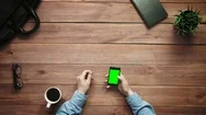 Top View Male Hands Showing Multiple Gestures On Smartphone With Green Screen  Stock Footage