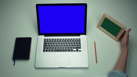 Top view male hands using laptop computer with green screen at white desk Stock Footage 82892917