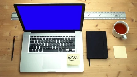 Top view male hands using laptop with green screen at wooden desk. Stock Footage 82895792