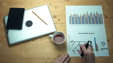 Top view male hands working with printed graphs making notes with marker Stock-Footage 82904024