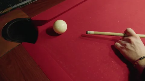 Top view of male player that successfully guides cue ball towards pocket Video stock 329192992