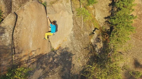Top view of a man climbing a rock crack without insurance. Stock Footage 149080993