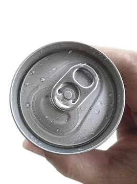 Top view. a man hand holds a cans isolated on white background Stock Photos