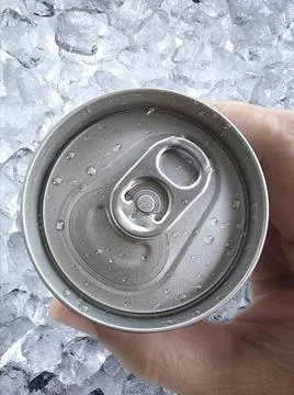 Top view. a man hand holds a cans Stock Photos