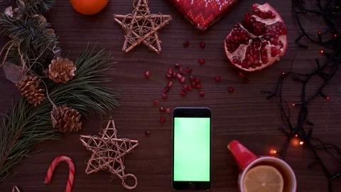 Top view man hand using smart phone with green screen. Finger scrolling pages on Stock Footage