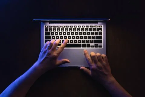 Top view of man hand using laptop at late night. Stock-Fotos