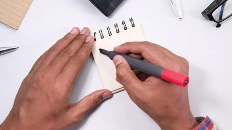 Top view of man hand writing to do list on a notebook Video stock 137660398